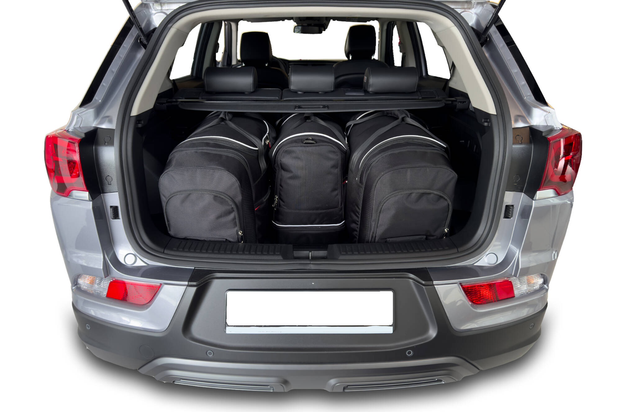 Torby KJUST AERO do Ssangyong Korando E-Motion IV — torby wyjmowane z bagażnika krok po kroku